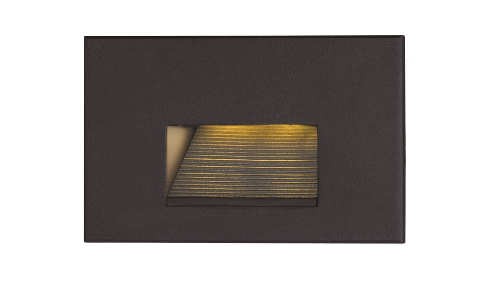 Image of Maxim Lighting's Path LED Step Light in a sleek black aluminum finish, mounted on a stairway, providing subtle and modern illumination.