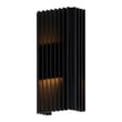 ET2 Rampart Outdoor Wall Sconce in Black finish, made of Aluminum, mounted on a brick wall, casting a warm, inviting glow.