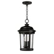 Maxim Lighting Dover Cast Outdoor Pendant in Bronze finish, featuring an elegant aluminum frame with a clear glass shade, hanging from a chain.