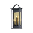Maxim Lighting Manchester Outdoor Wall Sconce in black aluminum finish, featuring a classic lantern design with clear glass panels for outdoor illumination.