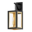 Maxim Lighting Neoclass Outdoor Wall Sconce, featuring a sleek Aluminum design in Black with Gold accents, elegantly illuminates an outdoor wall.