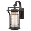 Maxim Lighting Oakville Outdoor Wall Light in Black Oxide finish, crafted from Aluminum, mounted on a brick wall, illuminating a garden path.
