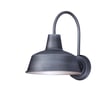 Maxim Lighting Pier M Outdoor Wall Light in Weathered Zinc finish, crafted from Aluminum, mounted on a brick wall, illuminating a garden path.