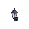 Maxim Lighting Westlake Cast Outdoor Wall Lantern in Black Aluminum finish, mounted on a brick wall, illuminating a garden path at dusk.