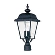 Maxim Lighting Builder Cast 3-Light Outdoor Pole/Post Lantern with a classic design, featuring a black finish and clear glass panels illuminating a garden path.