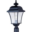 Maxim Lighting Senator Outdoor Post Light with a traditional design, featuring a black finish and clear glass panels, illuminating a garden pathway.