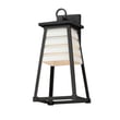 Maxim Lighting Shutters Outdoor Wall Sconce in White with Black finish, made of EPMM Aluminum, mounted on an exterior wall.