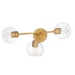 Maxim Lighting Knox Bathroom Vanity Light in Natural Aged Brass finish, featuring a sleek design with steel and glass elements, mounted on a bathroom wall.
