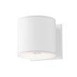 Maxim Lighting Stout Indoor/Outdoor Wall Sconce with a white aluminum finish and glass shade, mounted on a wall, illuminating the surrounding area.
