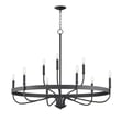 Frankie Chandelier by Maxim Lighting, featuring a sleek steel frame with a black finish, elegantly suspends multiple lights in a modern design.