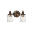 Maxim Lighting Swirl Bath Vanity with Antique Bronze finish, featuring a steel frame and swirling glass shades, elegantly illuminates a bathroom space.