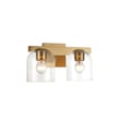 Maxim Lighting Scoop Bathroom Vanity Light in Natural Aged Brass finish, featuring a sleek design with steel frame and glass shades.