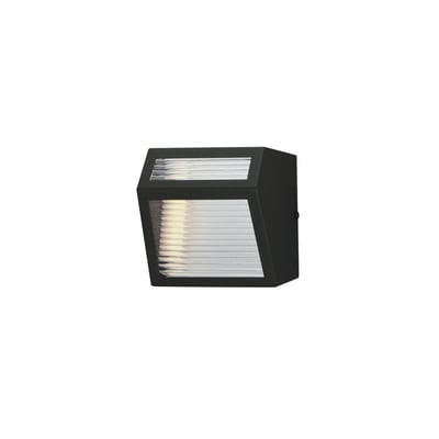 ET2 Totem Outdoor Wall Sconce in Black finish, made of Aluminum, mounted on a brick wall, casting a warm, inviting light.