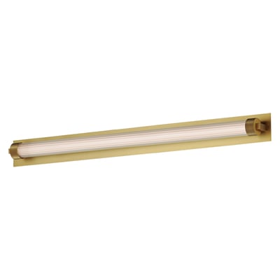 ET2 Doric Wall Sconce in Natural Aged Brass finish, crafted from Steel, elegantly mounted on a wall, casting a warm, inviting glow.