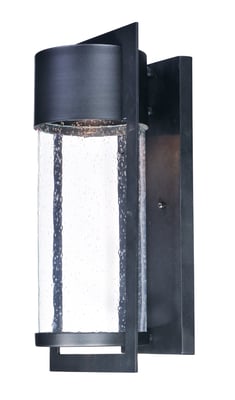 Maxim Lighting Focus LED Outdoor Wall Sconce in black aluminum finish, mounted on a wall, emits soft light, showcasing its sleek, modern design.