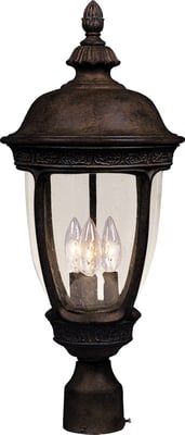 Maxim Lighting's Knob Hill Cast Outdoor Pole Post Lantern in Sienna finish, crafted from durable aluminum, elegantly lights up a garden path.