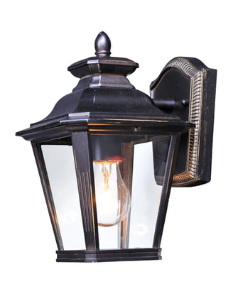 Maxim Lighting Knoxville Outdoor Wall Lantern in Bronze finish, featuring an elegant aluminum frame with clear glass panels, illuminating a warm glow.