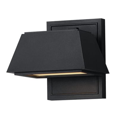 Maxim Lighting Mansard LED Outdoor Sconce in black aluminum finish, mounted on a wall, emits a warm glow, showcasing modern design elements.