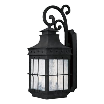 Maxim Lighting Nantucket Outdoor Wall Light with a Country Forge finish, crafted from Steel and Glass, elegantly illuminates an outdoor space.