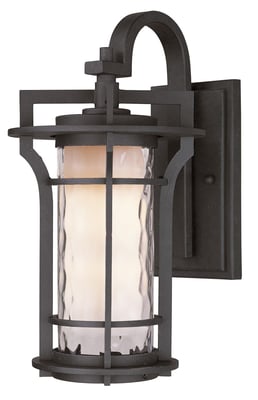 Maxim Lighting Oakville Outdoor Wall Light in Black Oxide finish, crafted from Aluminum, mounted on a brick wall, illuminating a garden path.
