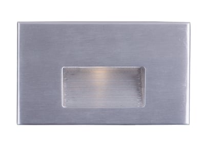 Maxim Lighting Path LED Step Light in Brushed Aluminum finish, mounted on a wall, illuminating a stairway with soft, ambient light.