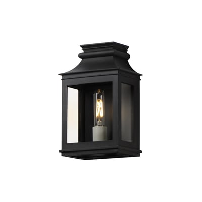 Maxim Lighting Savannah VX Outdoor Wall Sconce in Black Oxide finish, crafted from Aluminum, elegantly illuminates a garden path with a classic design.