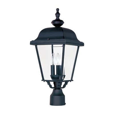 Maxim Lighting Builder Cast 3-Light Outdoor Pole/Post Lantern with a classic design, featuring a black finish and clear glass panels illuminating a garden path.