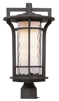 Maxim Lighting Oakville Outdoor Post Light with a rustic finish, featuring a lantern-style design and clear glass panels, mounted on a tall post.