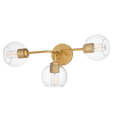 Maxim Lighting Knox Bathroom Vanity Light in Natural Aged Brass finish, featuring a sleek design with steel and glass elements, mounted on a bathroom wall.