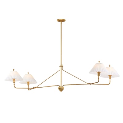 Maxim Lighting Kismet Linear Suspension in Gold Leaf finish, featuring a sleek steel frame and elegant glass accents, hangs stylishly over a modern dining table.