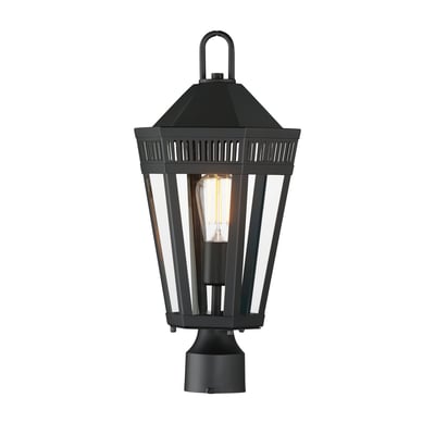 Maxim Lighting Oxford Outdoor Pier Light in black finish, featuring a sleek steel and glass design, illuminating an outdoor setting.
