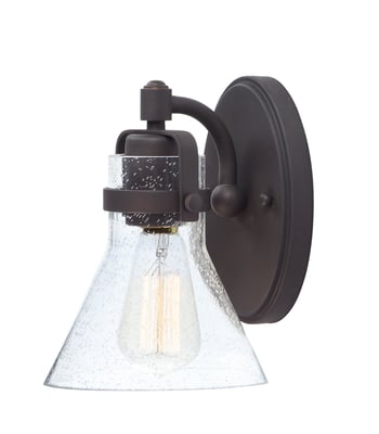 Maxim Lighting Seafarer Wall Sconce featuring a steel frame with oil rubbed bronze finish and clear glass shade, mounted on a wall.